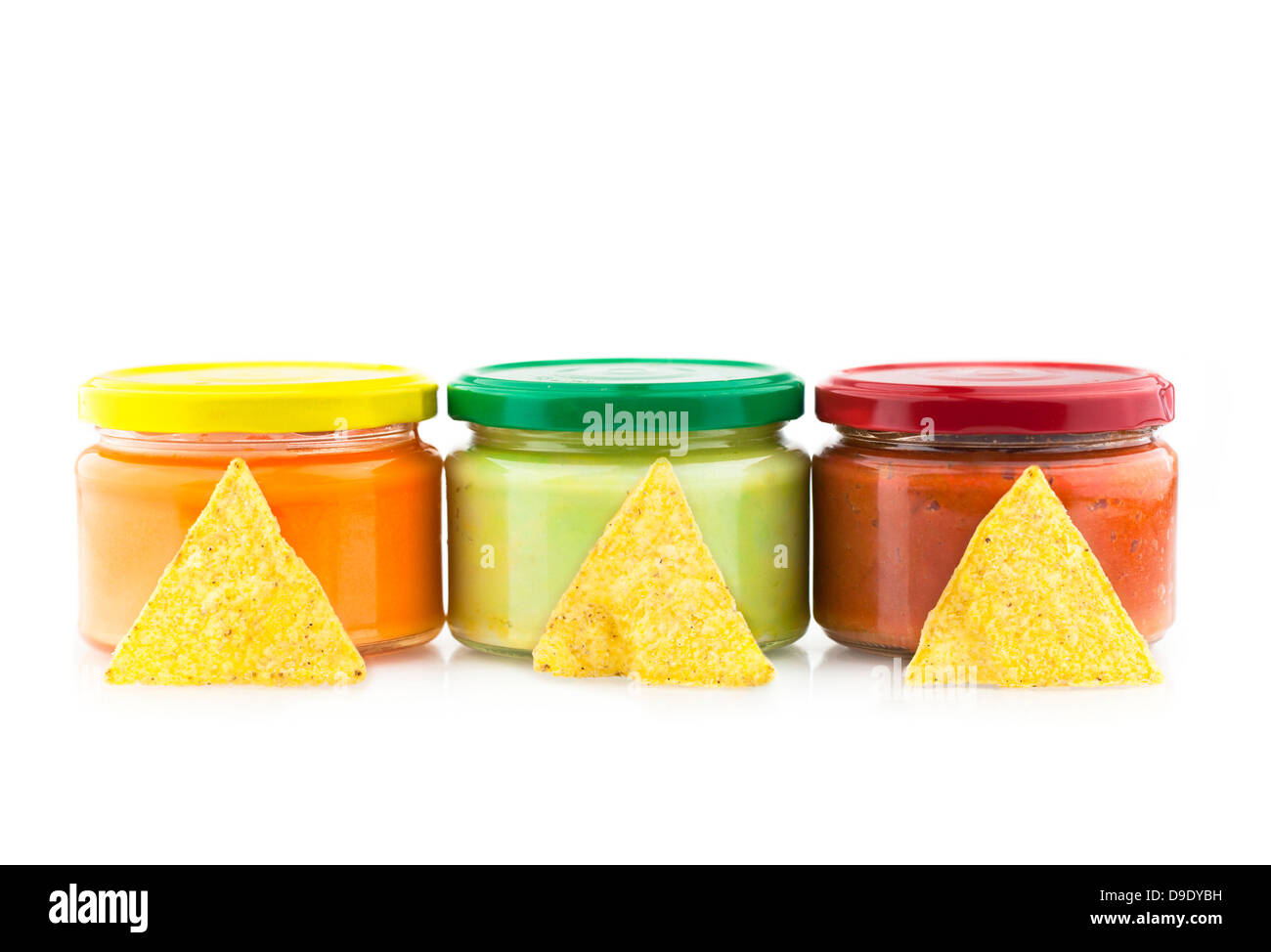 Traditional Mexican dips made of cheese, guacamole and tomato chutney in jars Stock Photo