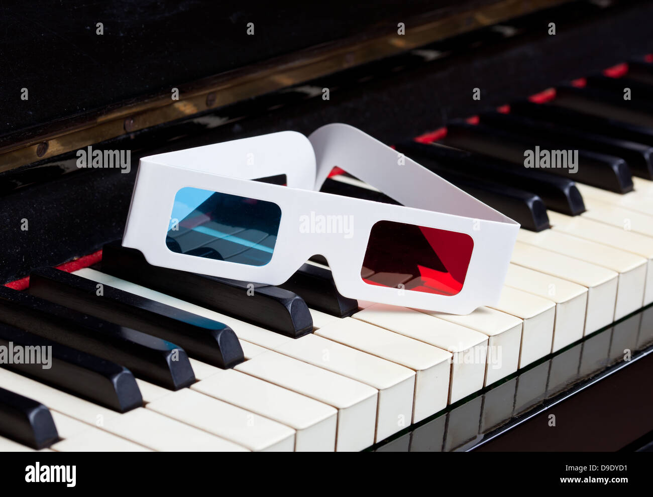 Three dimensional music concept with piano keyboard and 3D glasses. Stock Photo