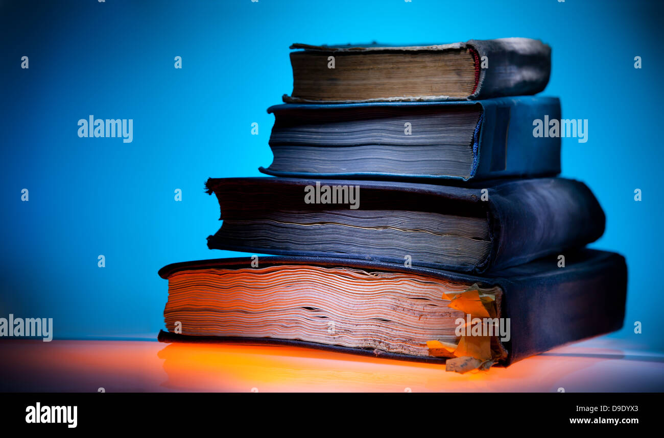 Old books, mystical blue light background Stock Photo - Alamy