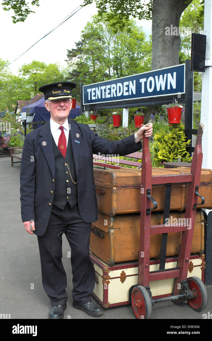 Station Master with vintage luggage at Tenterden Kent and East Sussex Railway Station England UK GB Stock Photo