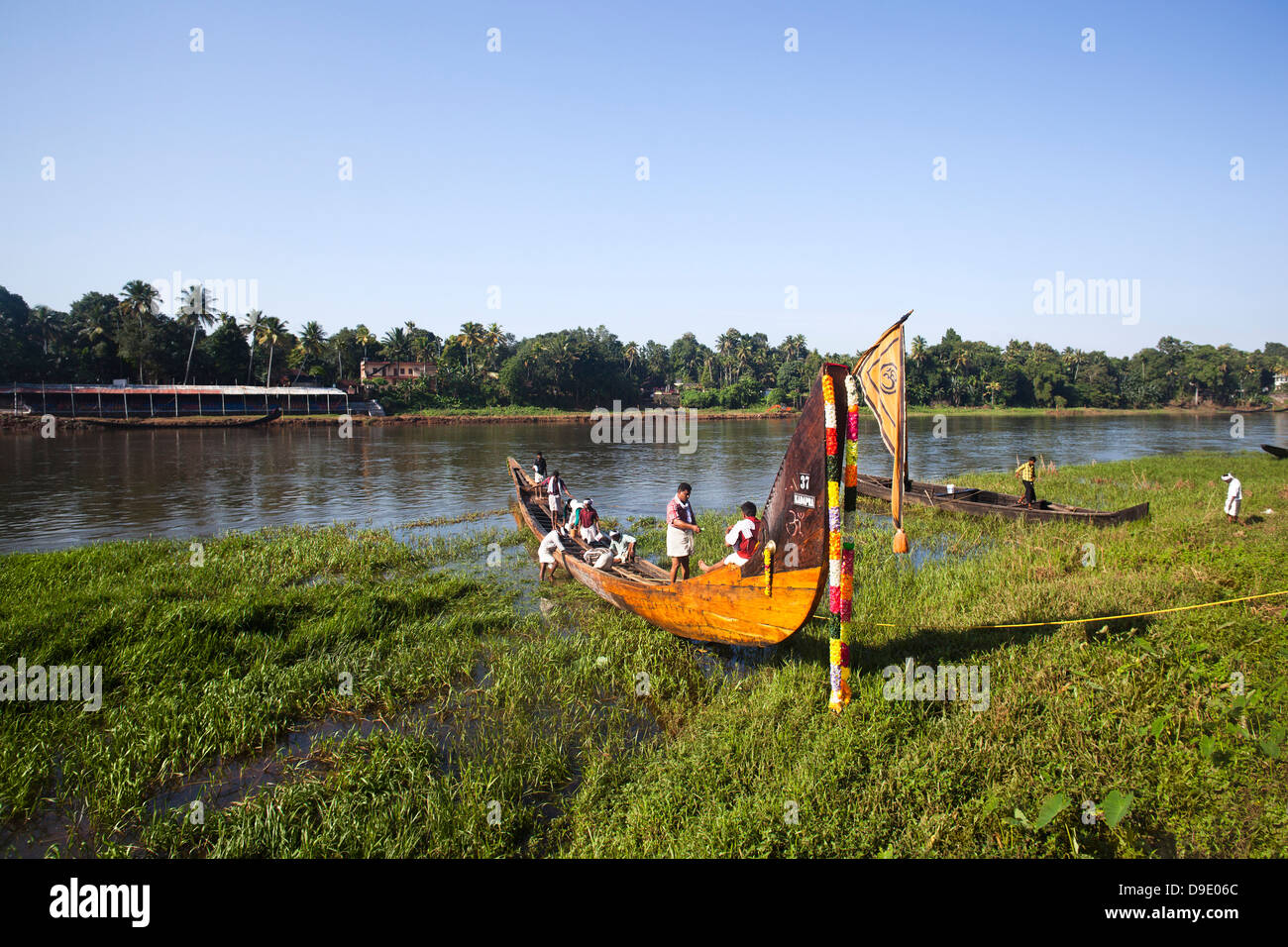 People in a snake boat at riverside, Aranmula, Kerala, India Stock Photo
