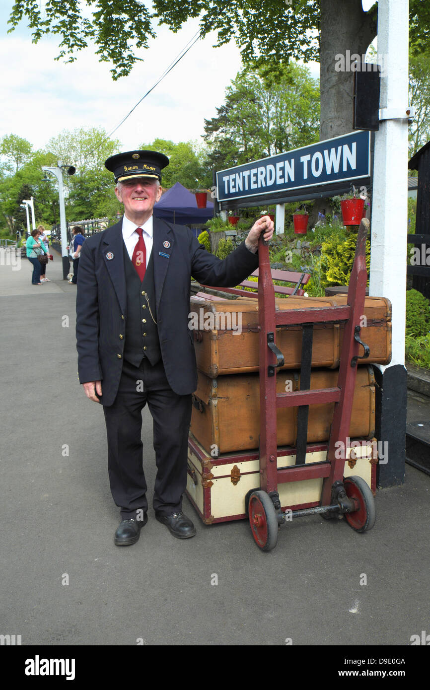 Station Master with vintage luggage at Tenterden Kent and East Sussex Railway Station England UK GB Stock Photo