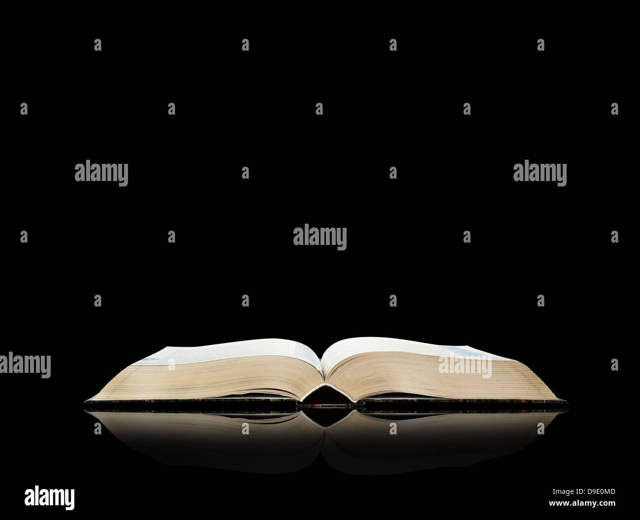 Open book, black background, space for text Stock Photo