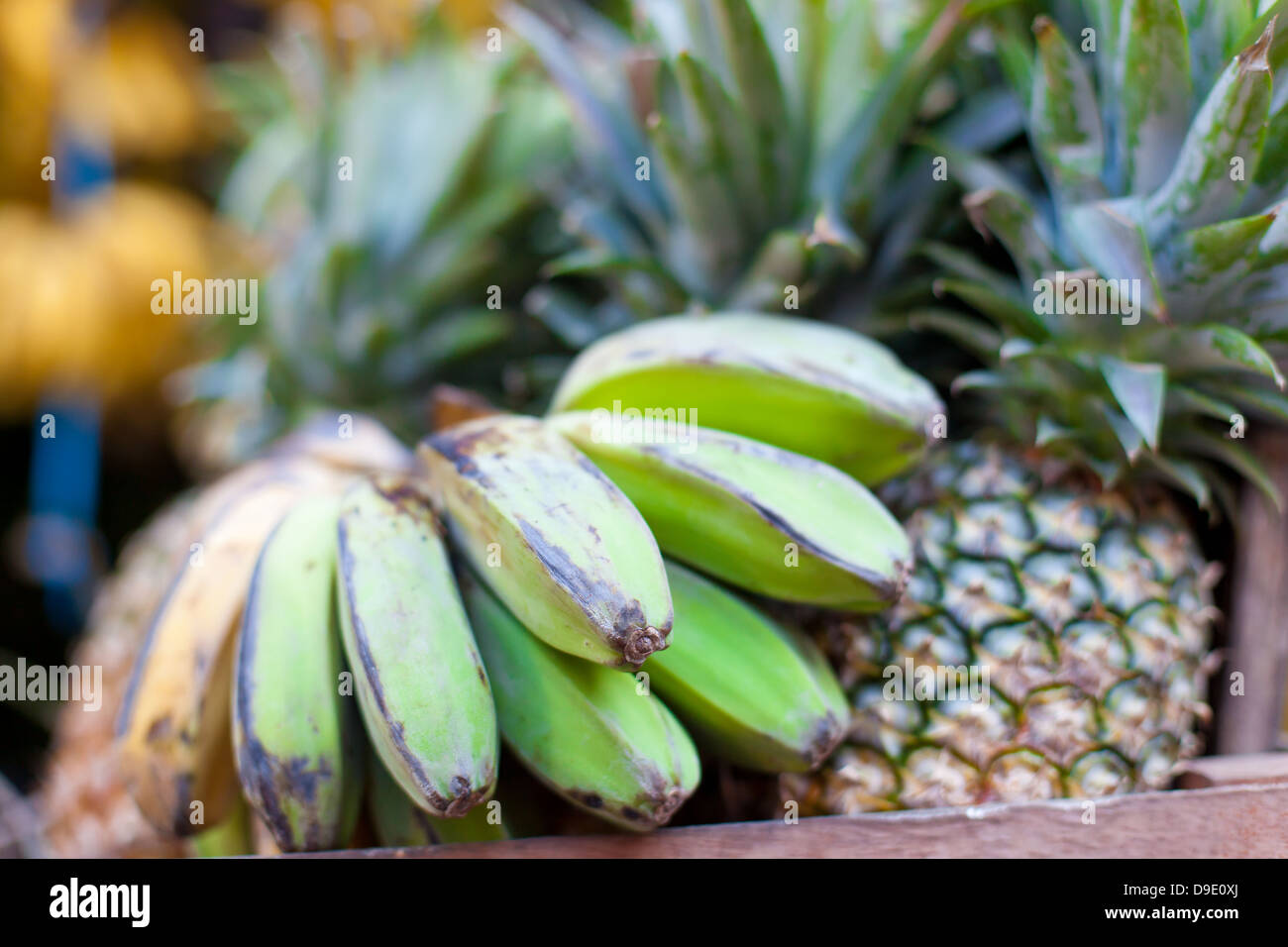 Bananas and pineapples on asian market Stock Photo Alamy