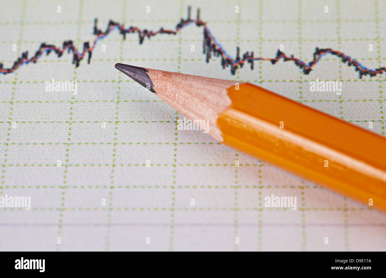 Financial chart of the stock market and pencil. Selective focus Stock Photo