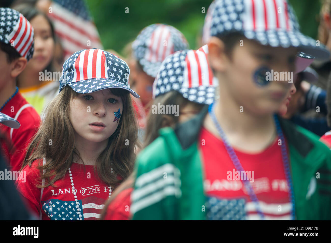 Students march in the annual Flag Day Parade on Friday, June 14, 2013