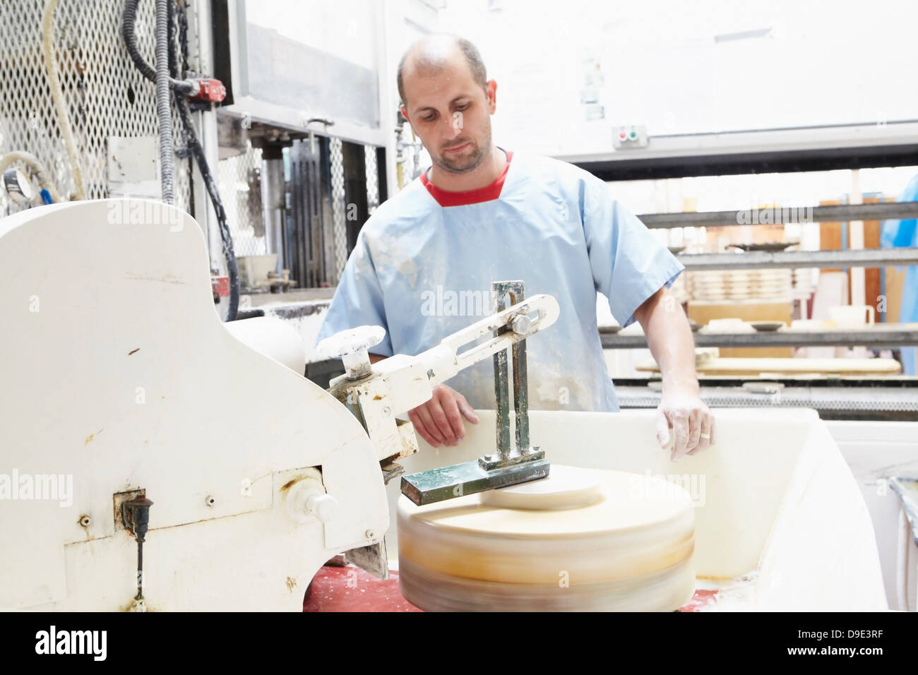 Man working in pottery factory Stock Photo