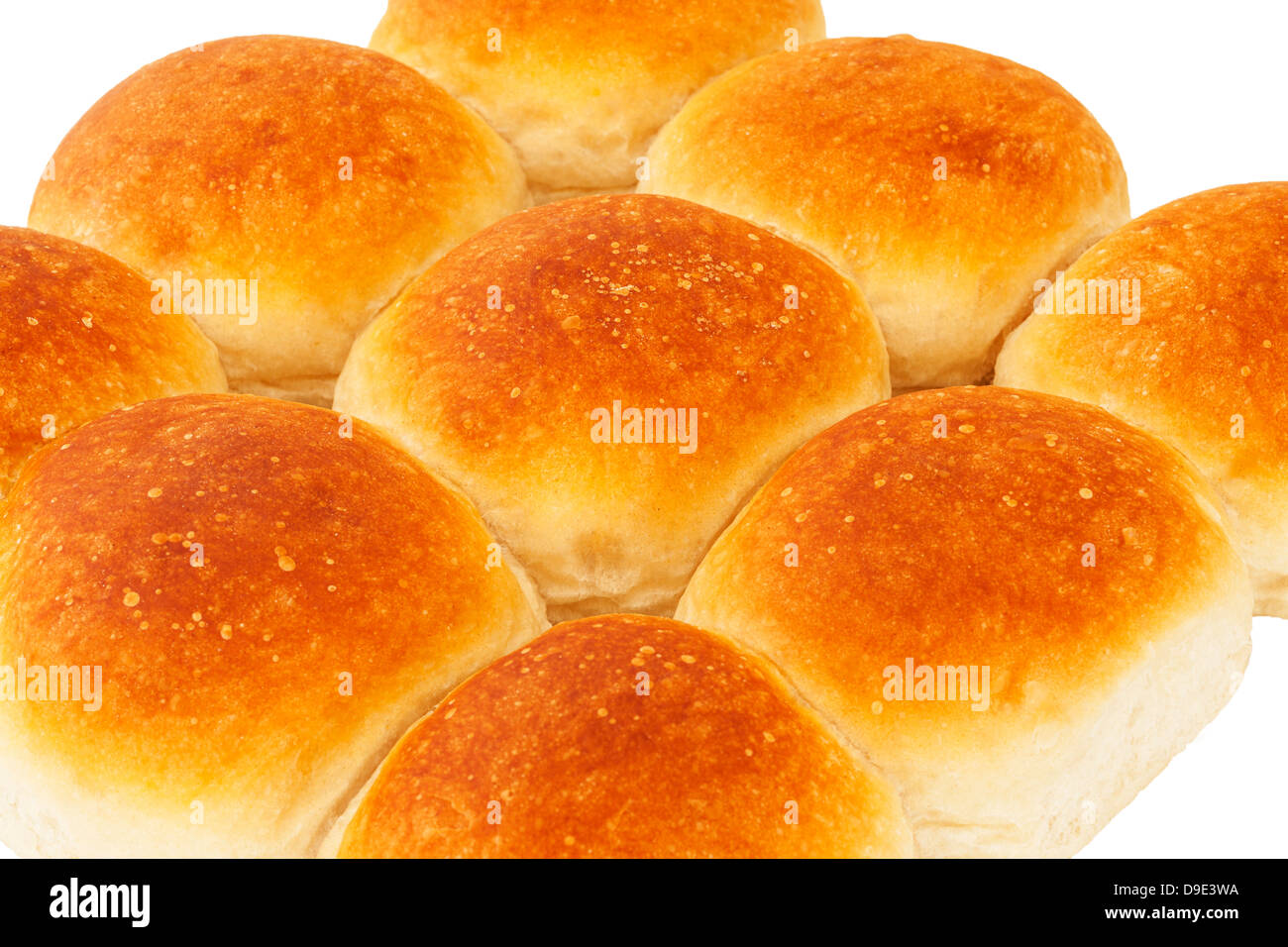 A home made batch of 9 white bread rolls on a white background Stock