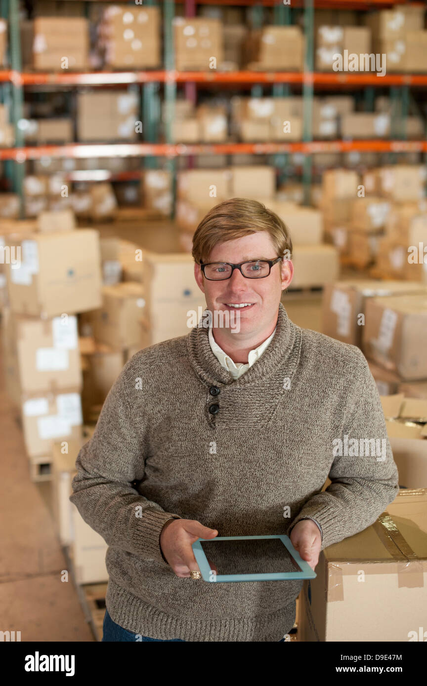 Portrait of male warehouse worker with digital tablet Stock Photo