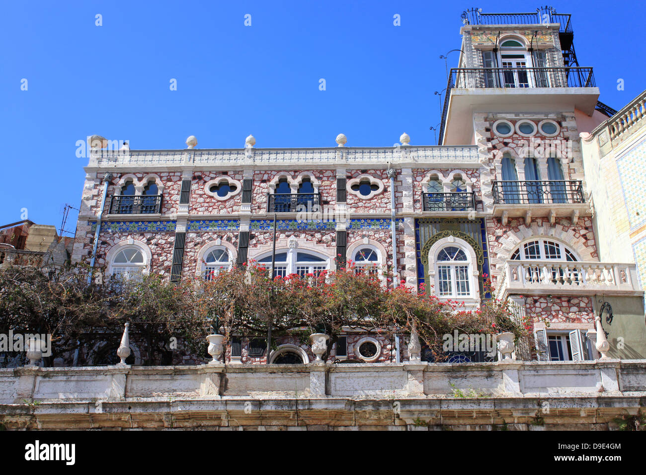 Windows in buildings of Alfama, Lisbon, showing decorative tiles in Alfama Portugal Stock Photo