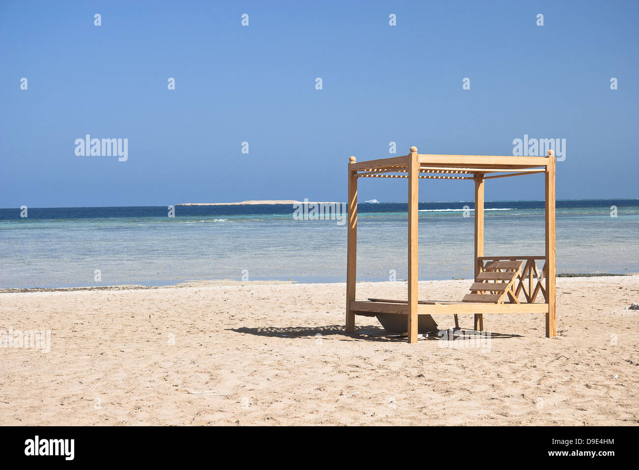Wooden beach lounge chairs along hi-res stock photography and images - Alamy
