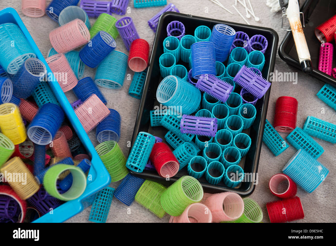 Brightly coloured plastic hair rollers Stock Photo - Alamy