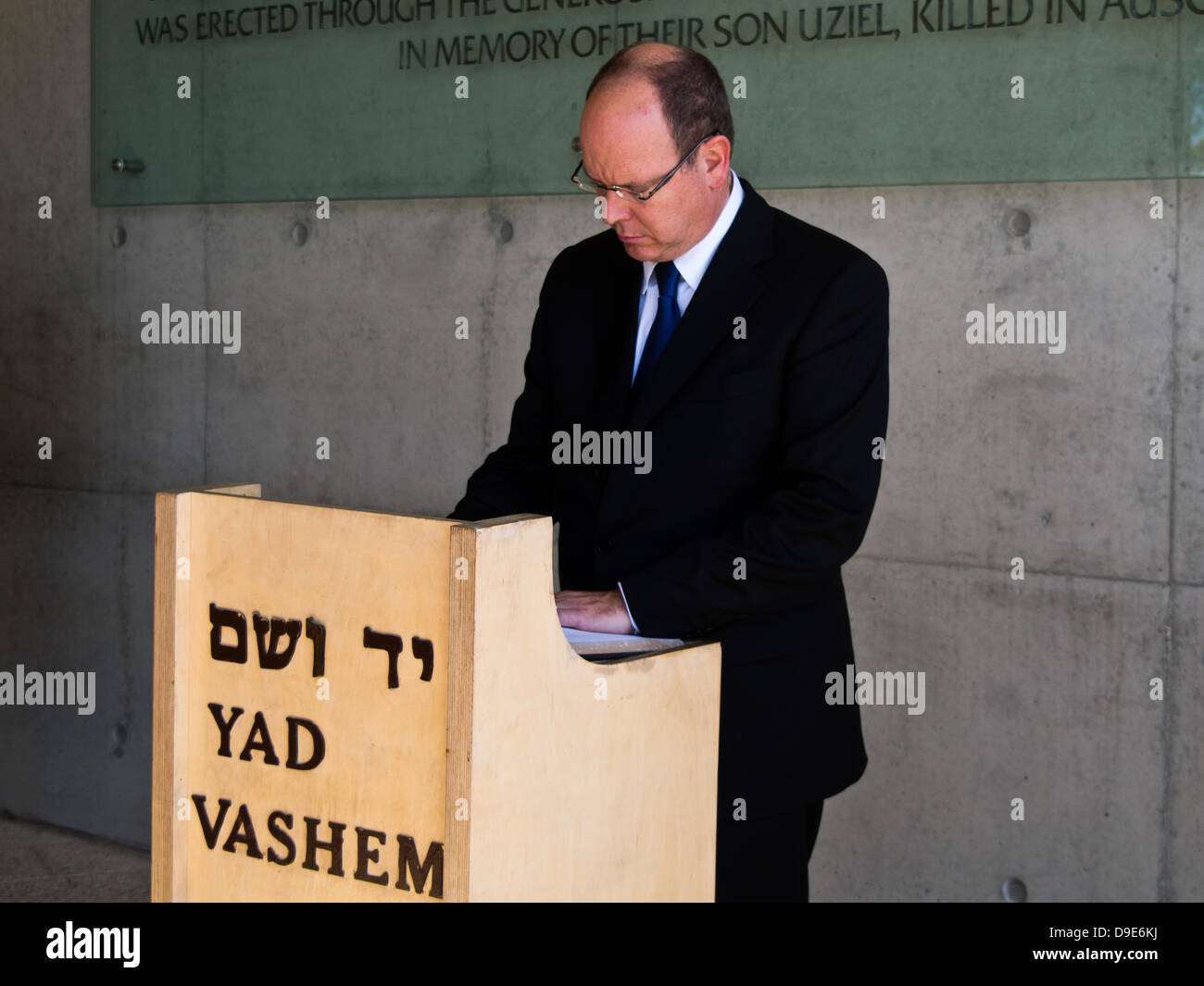 erusalem, Israel. 18-June-2013. PRINCE ALBERT II, signs the guestbook concluding his visit to Yad Vashem Holocaust Museum. Jerusalem, Israel. 18-June-2013.  Prince Albert II, reigning monarch of the Principality of Monaco, visits Yad Vashem Holocaust Museum. Prince Albert II will be taking part in the upcoming Facing Tomorrow - Israeli Presidential Conference. Credit:  Nir Alon/Alamy Live News Stock Photo