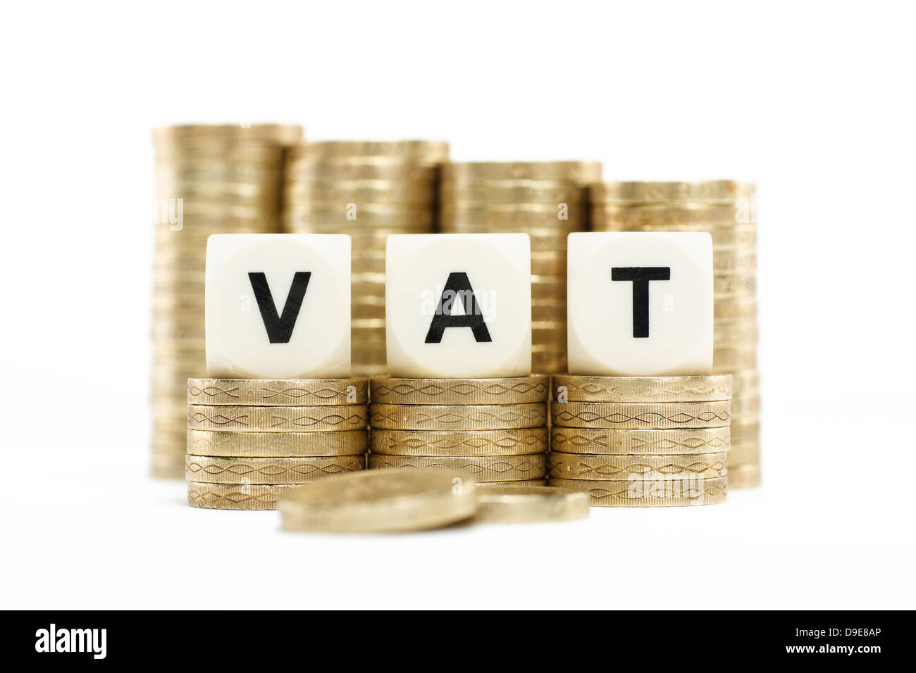 VAT (Value Added Tax) on Stacks of Gold Coins with White Background Stock Photo