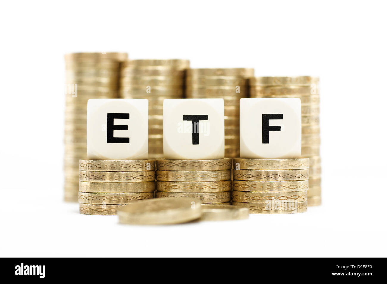 ETF (Exchange Traded Fund) on gold coins with white background Stock Photo