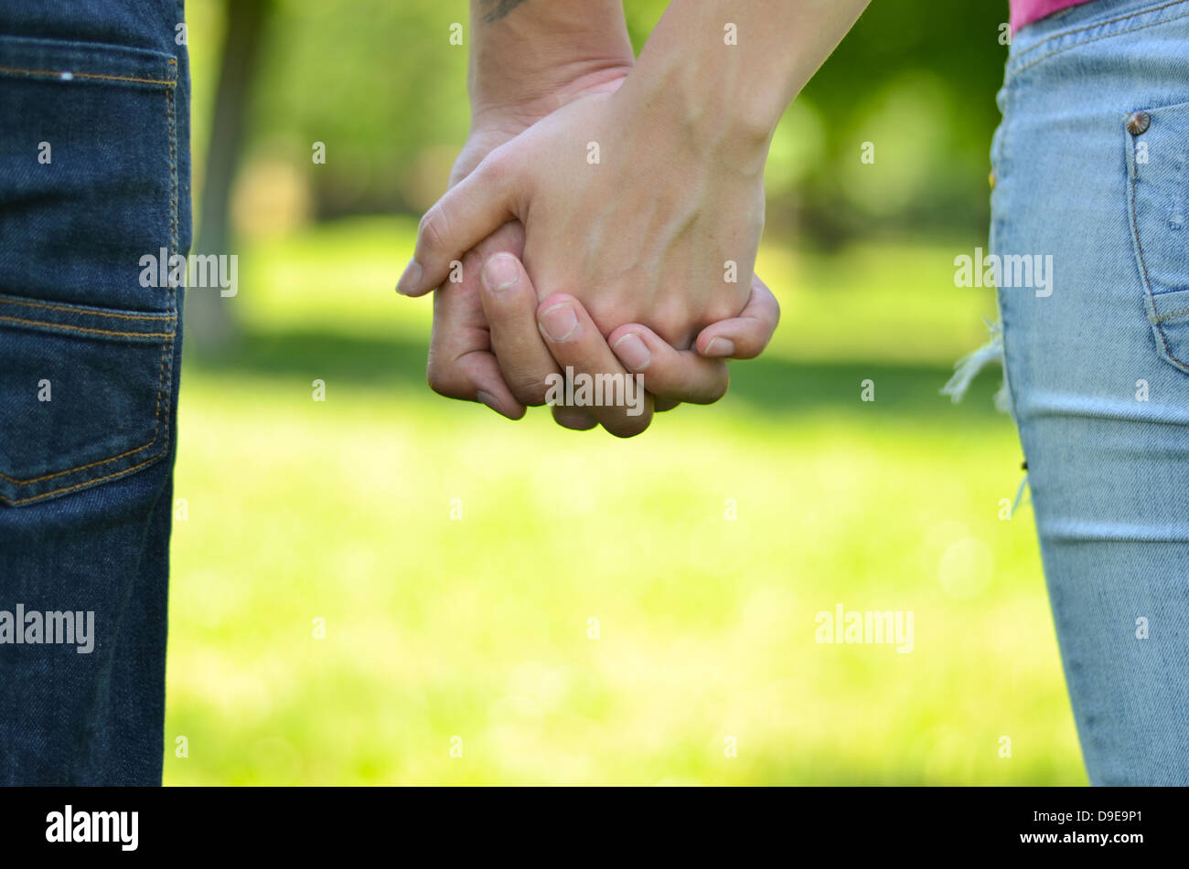 Couple holding hands Stock Photo Alamy