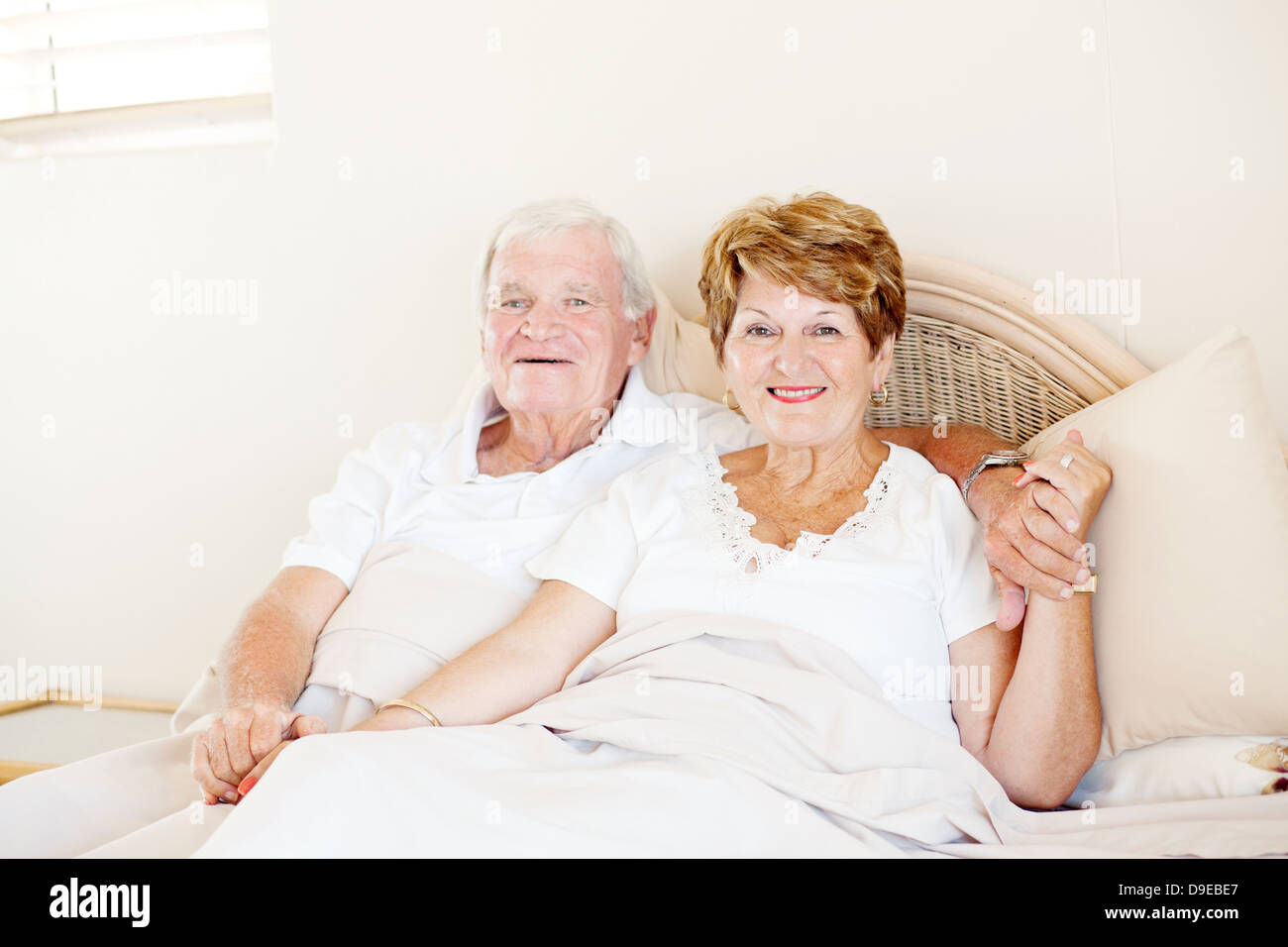 Romantic couple in bed hi-res stock photography and images - Alamy