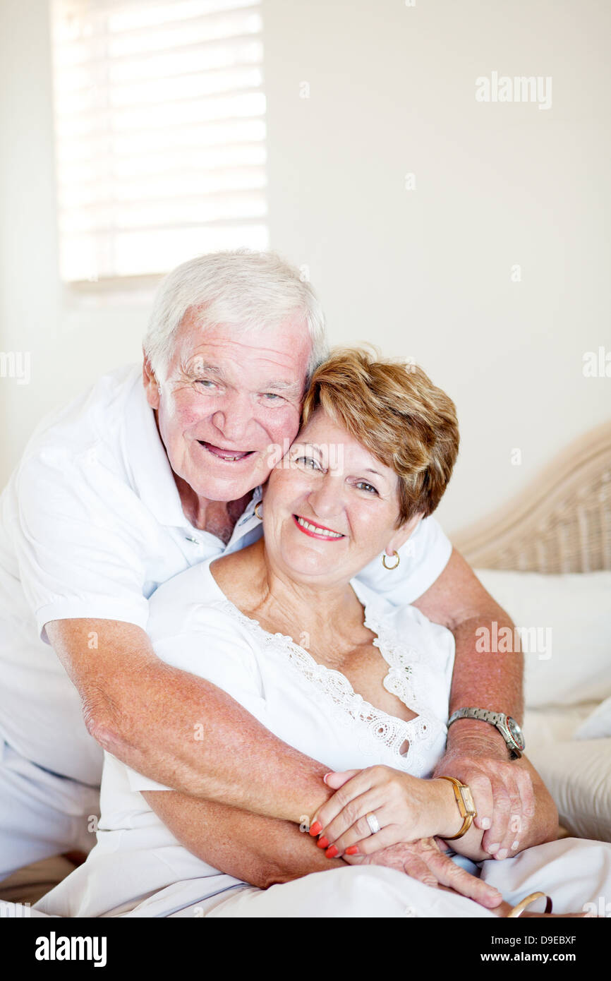 Old couple embracing in bed hi-res stock photography and images - Alamy