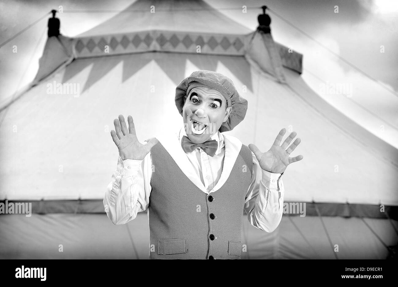 Circus clown outside big top tent Stock Photo