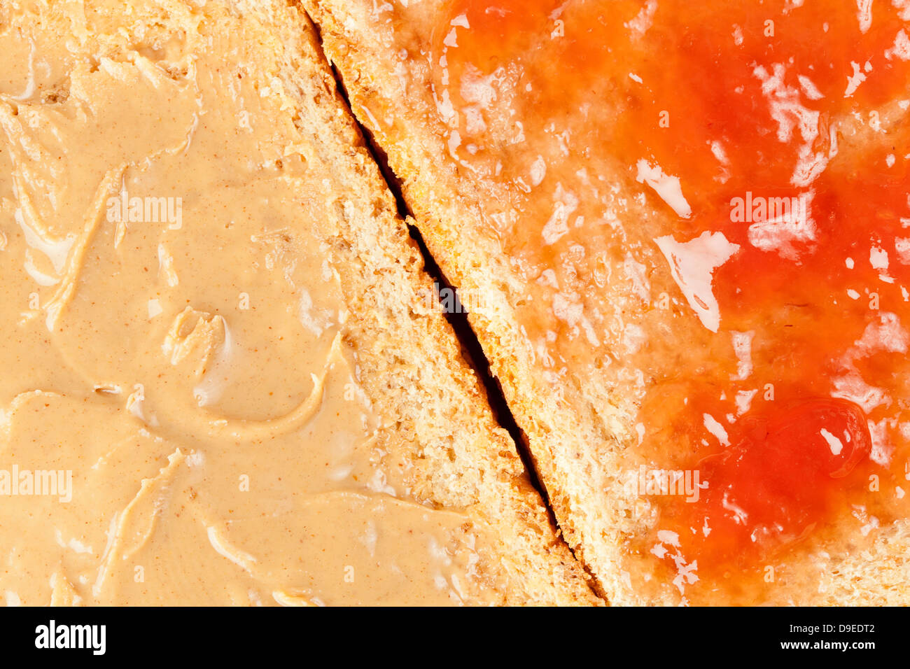 Homemade Peanut Butter and Jelly Sandwich against a background Stock Photo
