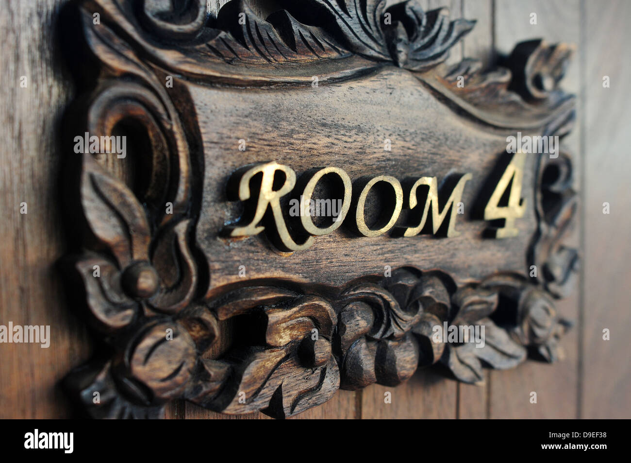 apartment black brass bronze classical close-up domestic exterior frame full gold house room 4 gate numerals object old Stock Photo