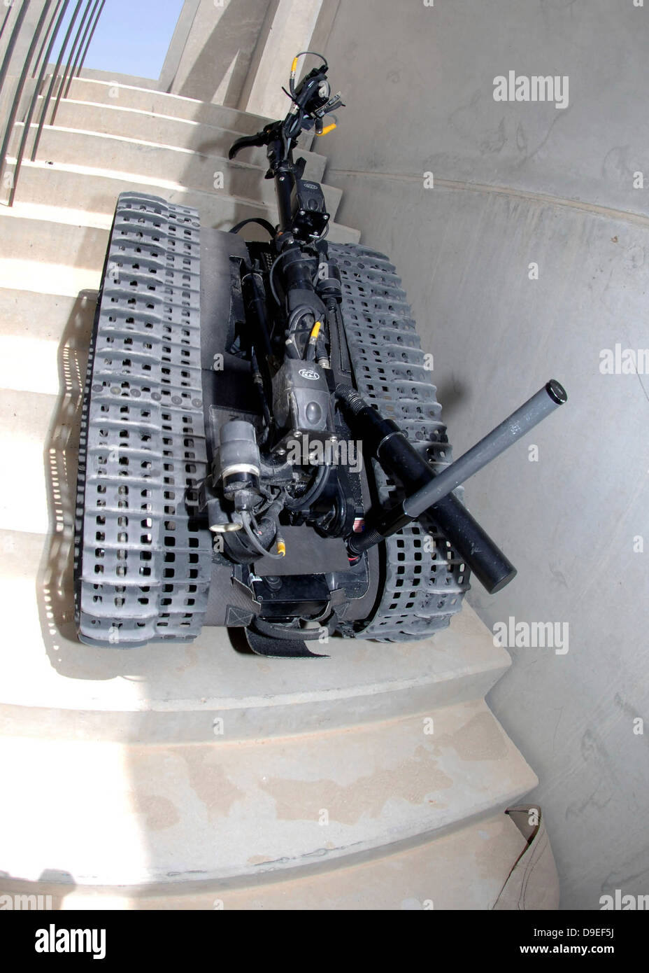 A Talon 3B robot unit climbing a flight of stairs during a training mission in Bahrain. Stock Photo