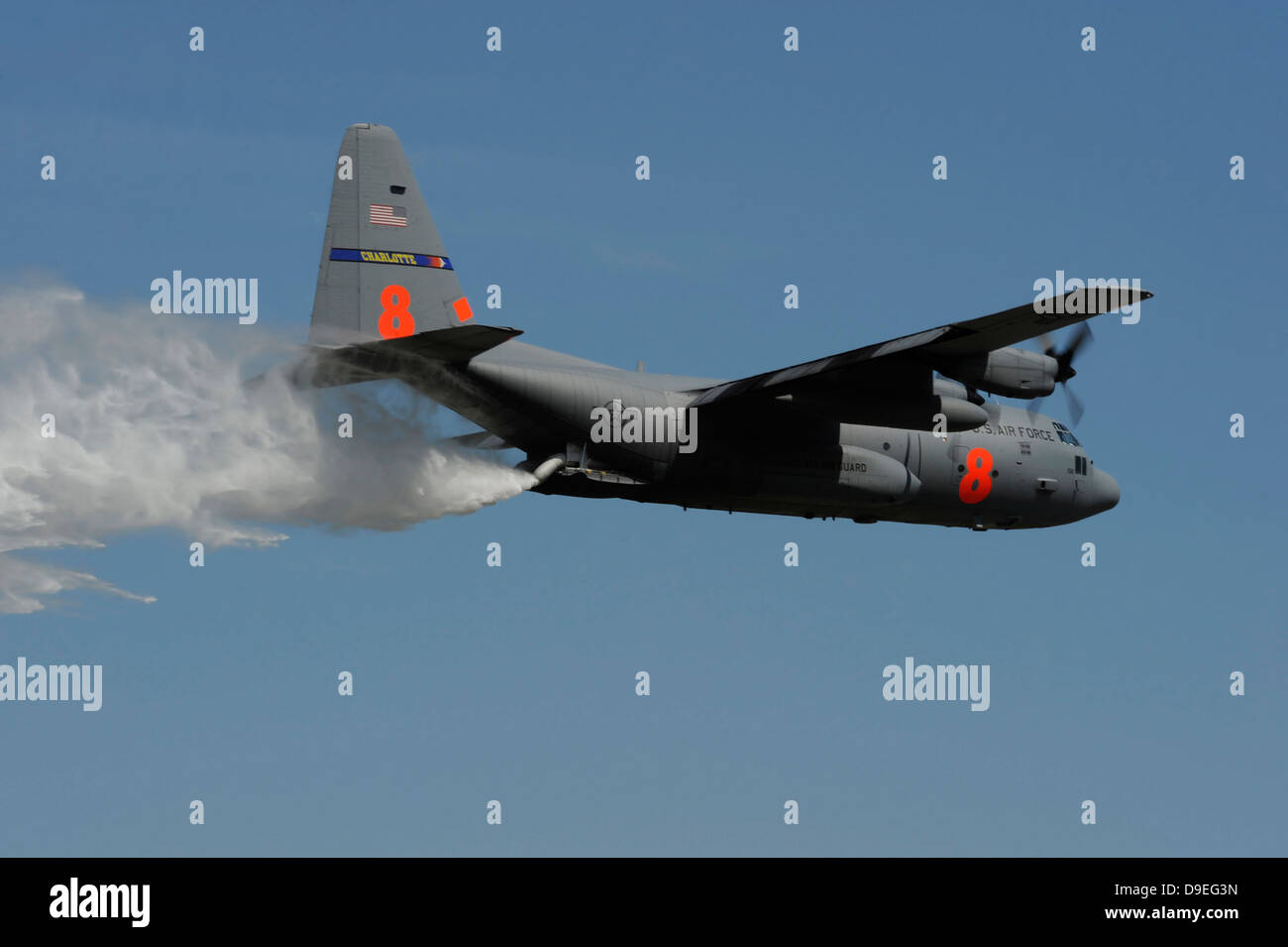 A U.S. Air Force C-130 Hercules releases its payload of water during training over South Carolina. Stock Photo