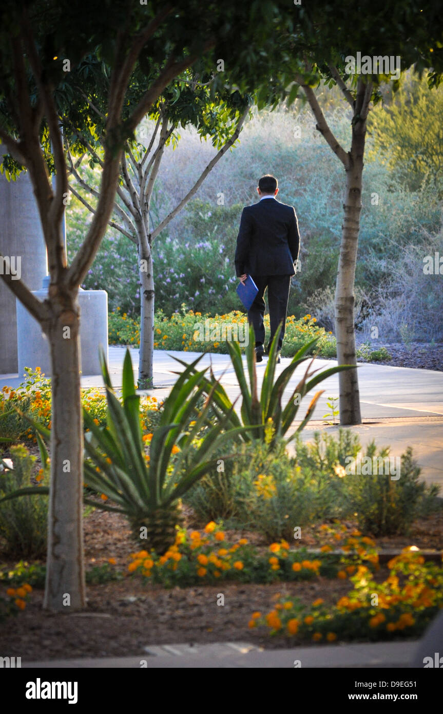 businessman walking in the park Stock Photo