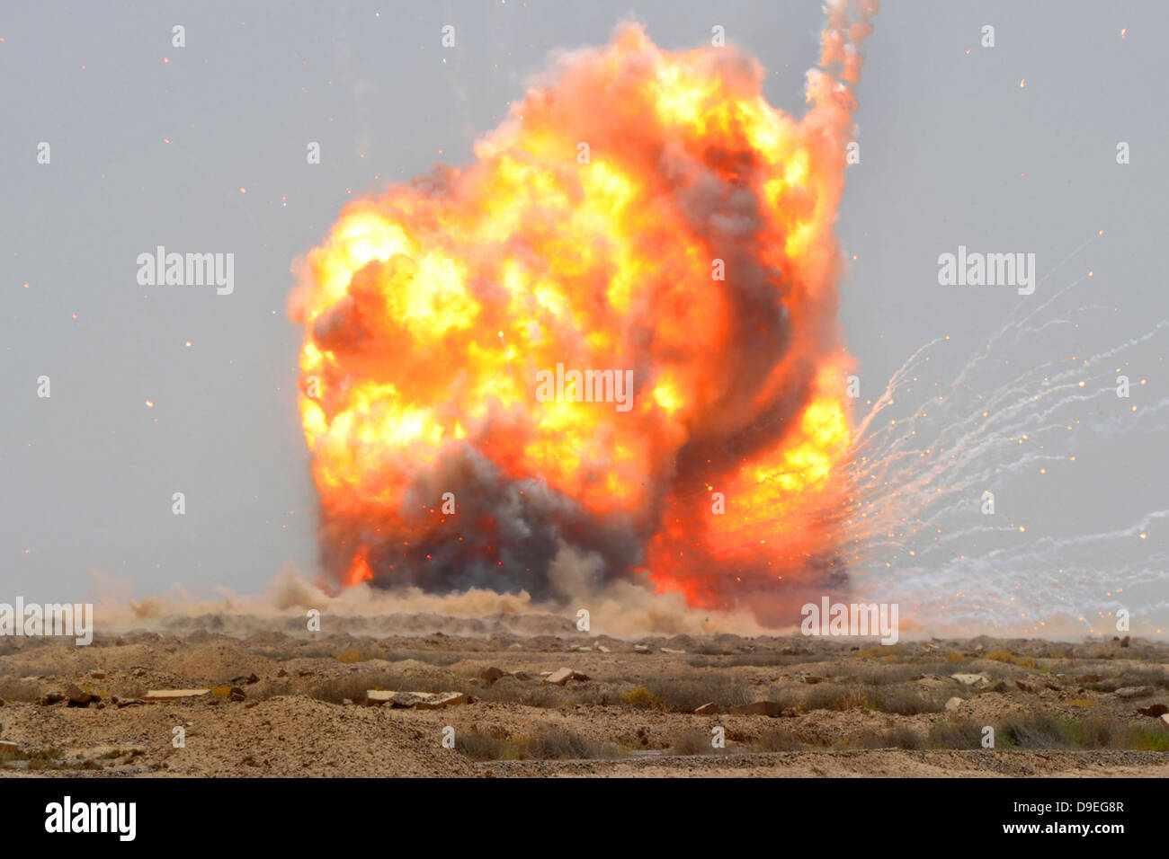 A controlled detonation is set off to destroy unexploded ordnance outside Bassami, Iraq. Stock Photo