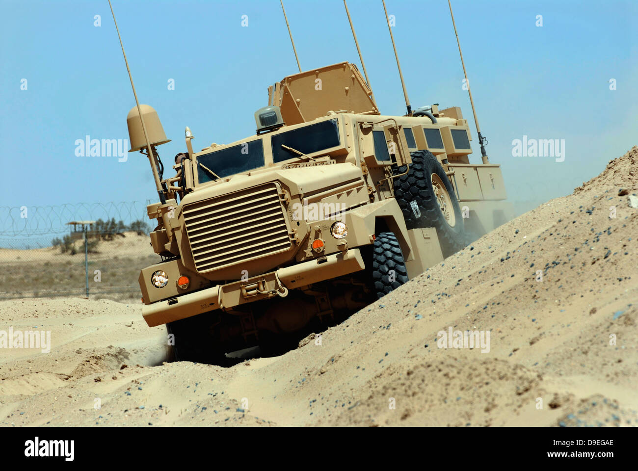 The Joint Explosive Ordnance Disposal Rapid Response Vehicle navigates over rough terrain. Stock Photo