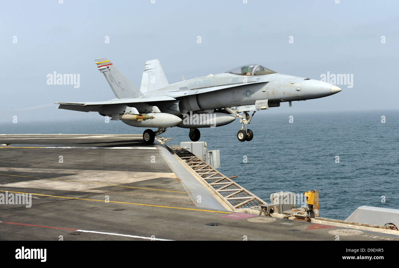 An F/A-18C Hornet launches from the aircraft carrier USS Harry S. Truman. Stock Photo