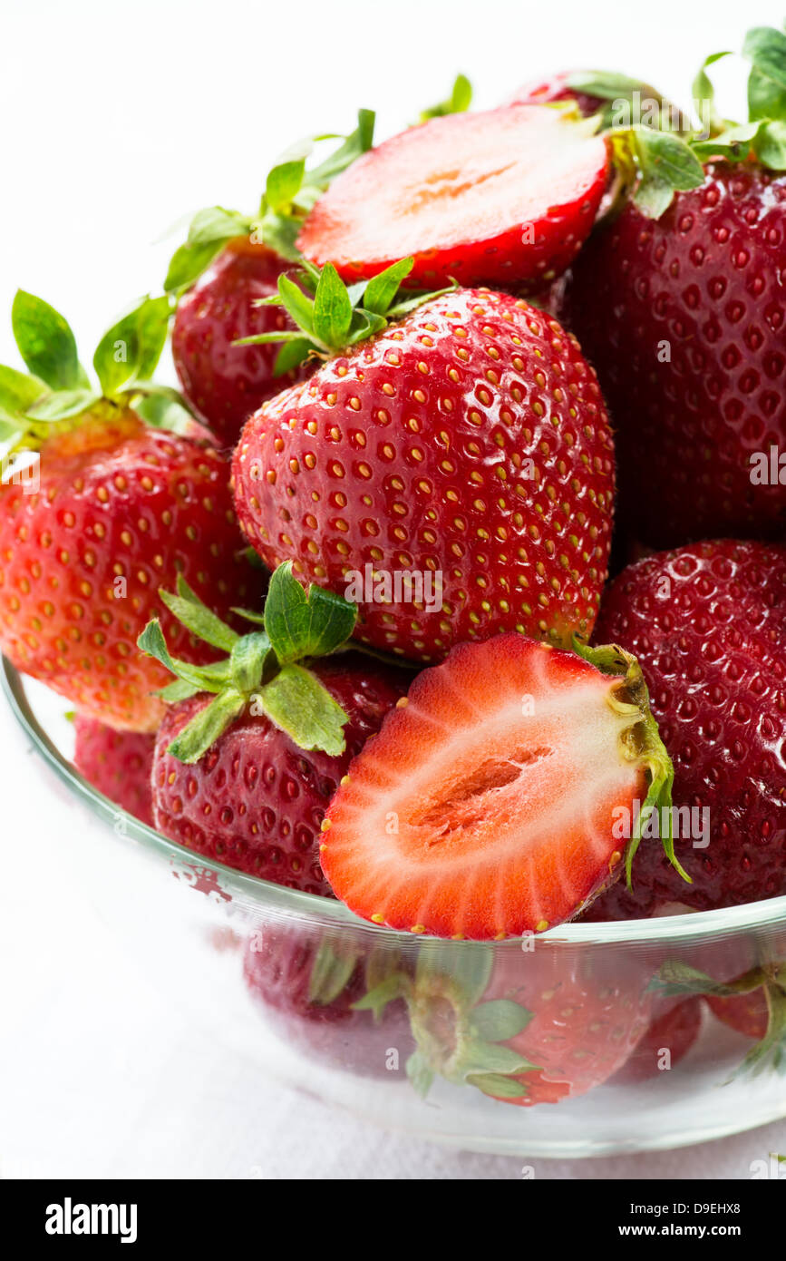 Strawberries in glass bowl on white background, closeup, selective focus Stock Photo