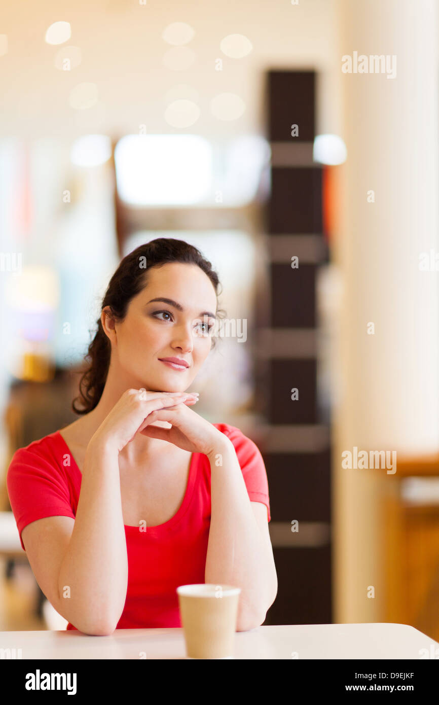 happy young woman sitting in coffee shop Stock Photo - Alamy