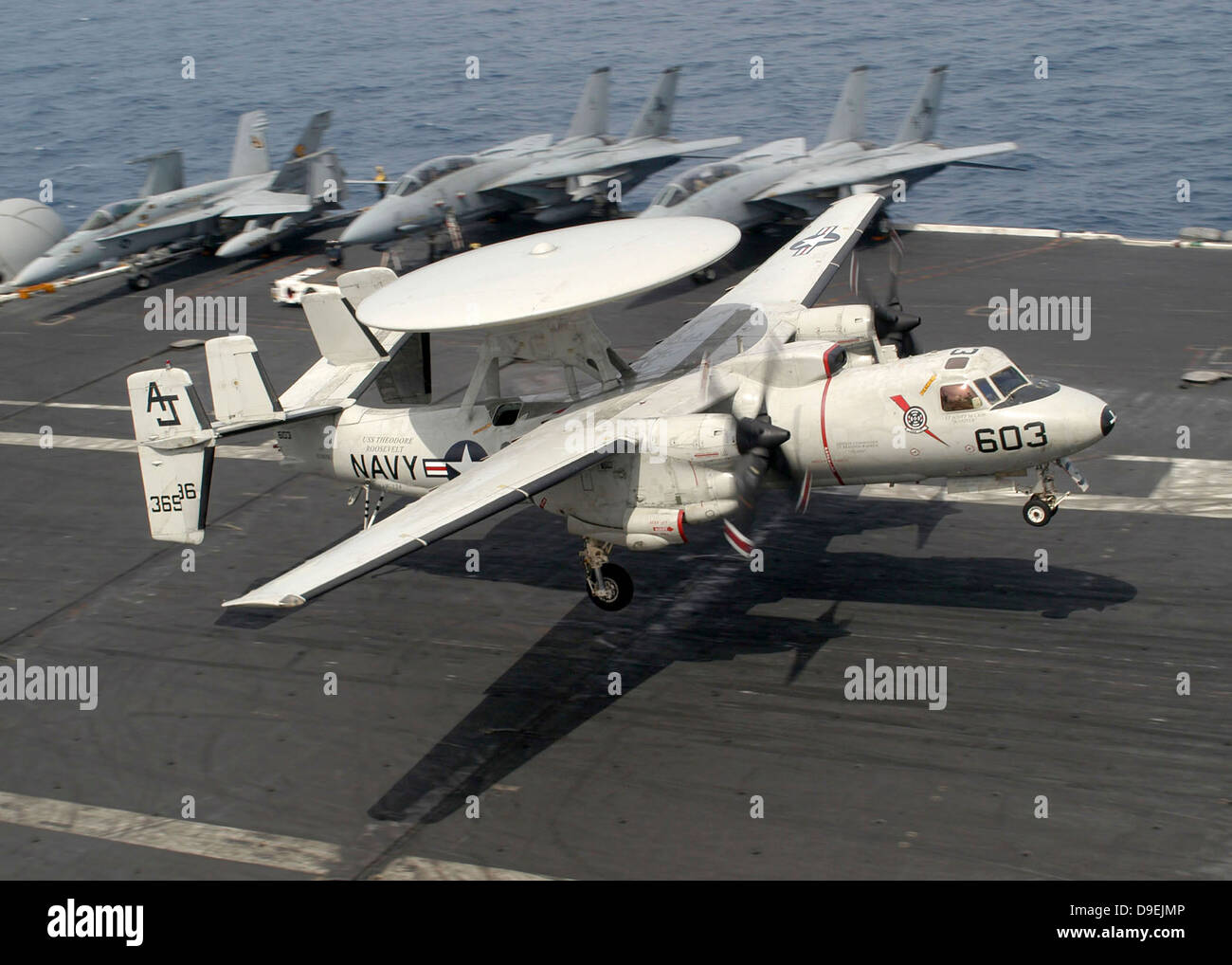 An E-2C Hawkeye lands on the flight deck of USS Theodore Roosevelt. Stock Photo