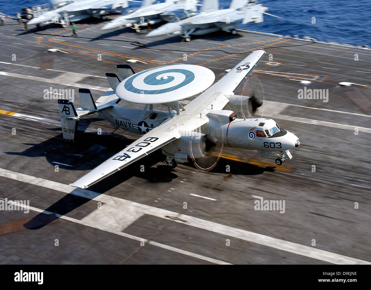 An E-2C Hawkeye lands on the flight deck of USS Enterprise. Stock Photo