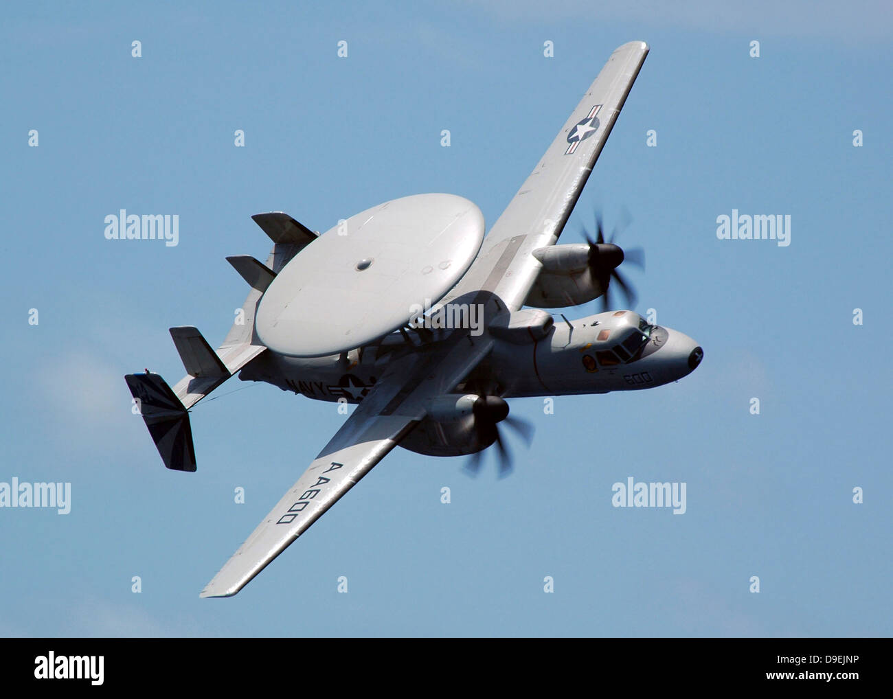 An E-2C Hawkeye executes a high performance fly-by during an Air Power Demonstration. Stock Photo
