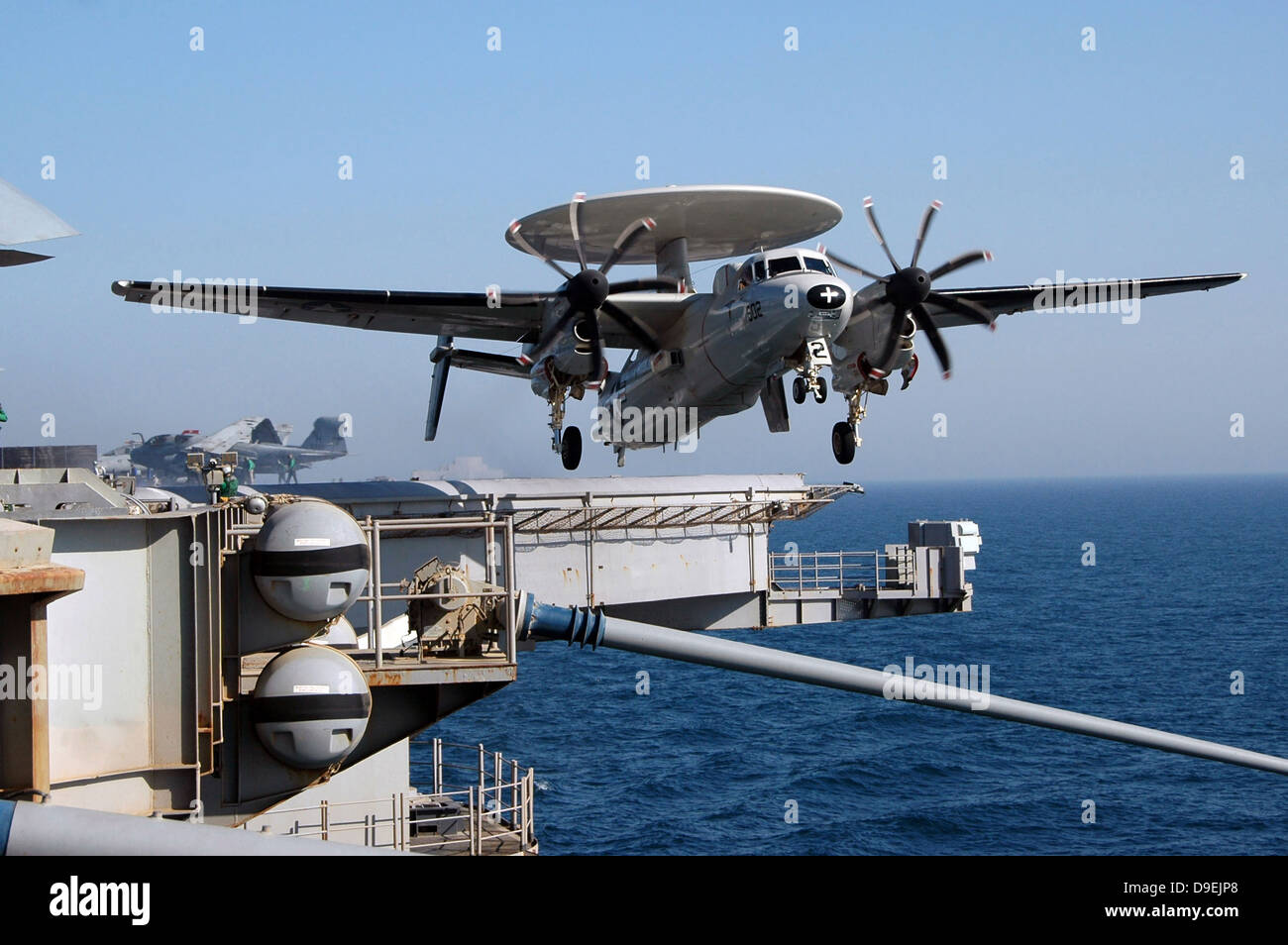 An E-2C Hawkeye launches off the flight deck of USS Nimitz. Stock Photo