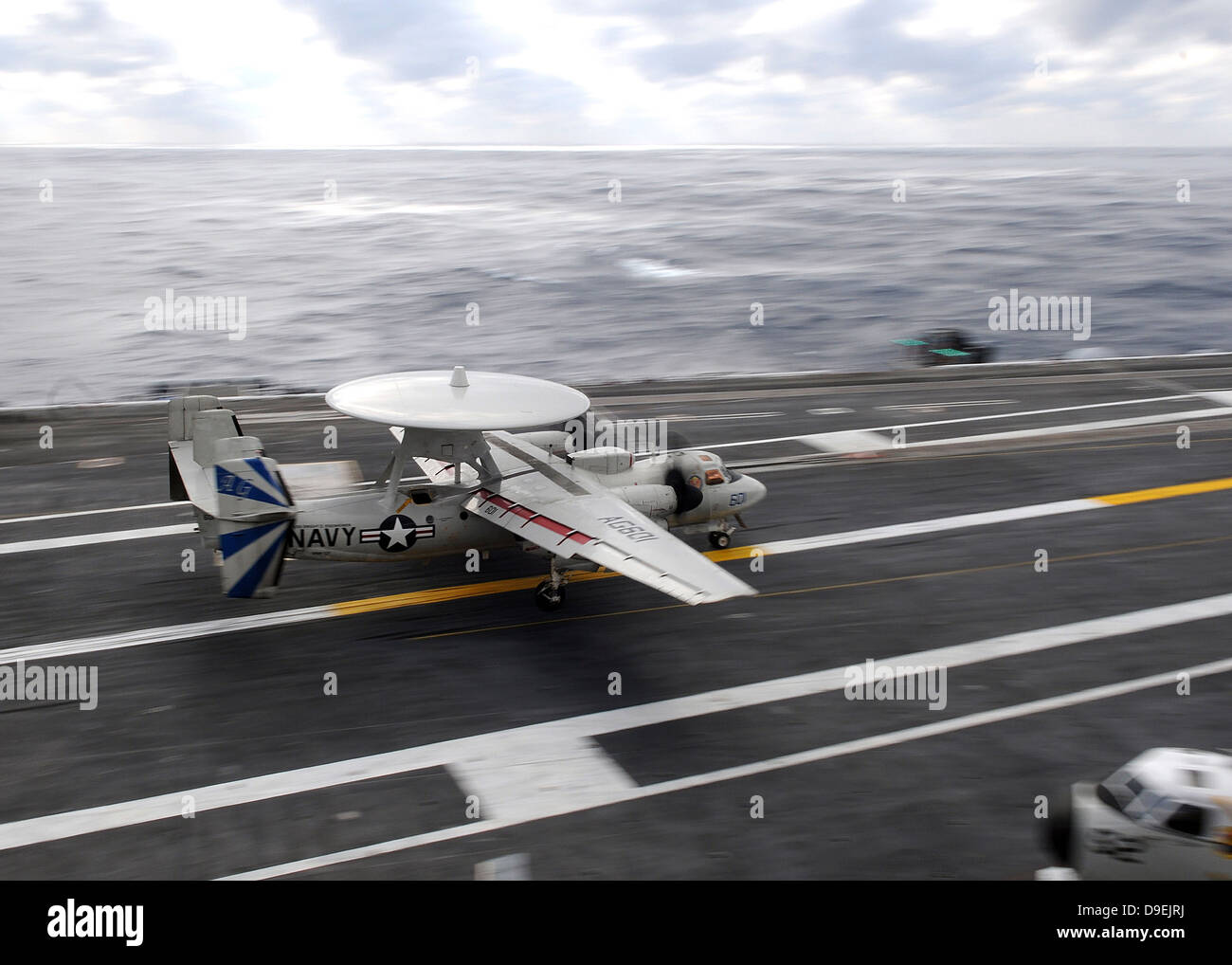 An E-2C Hawkeye conducts a touch-and-go landing aboard USS Dwight D. Eisenhower. Stock Photo