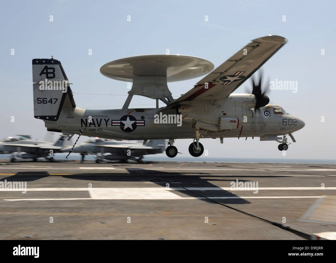 An E-2C Hawkeye lands aboard the aircraft carrier USS Enterprise Stock Photo