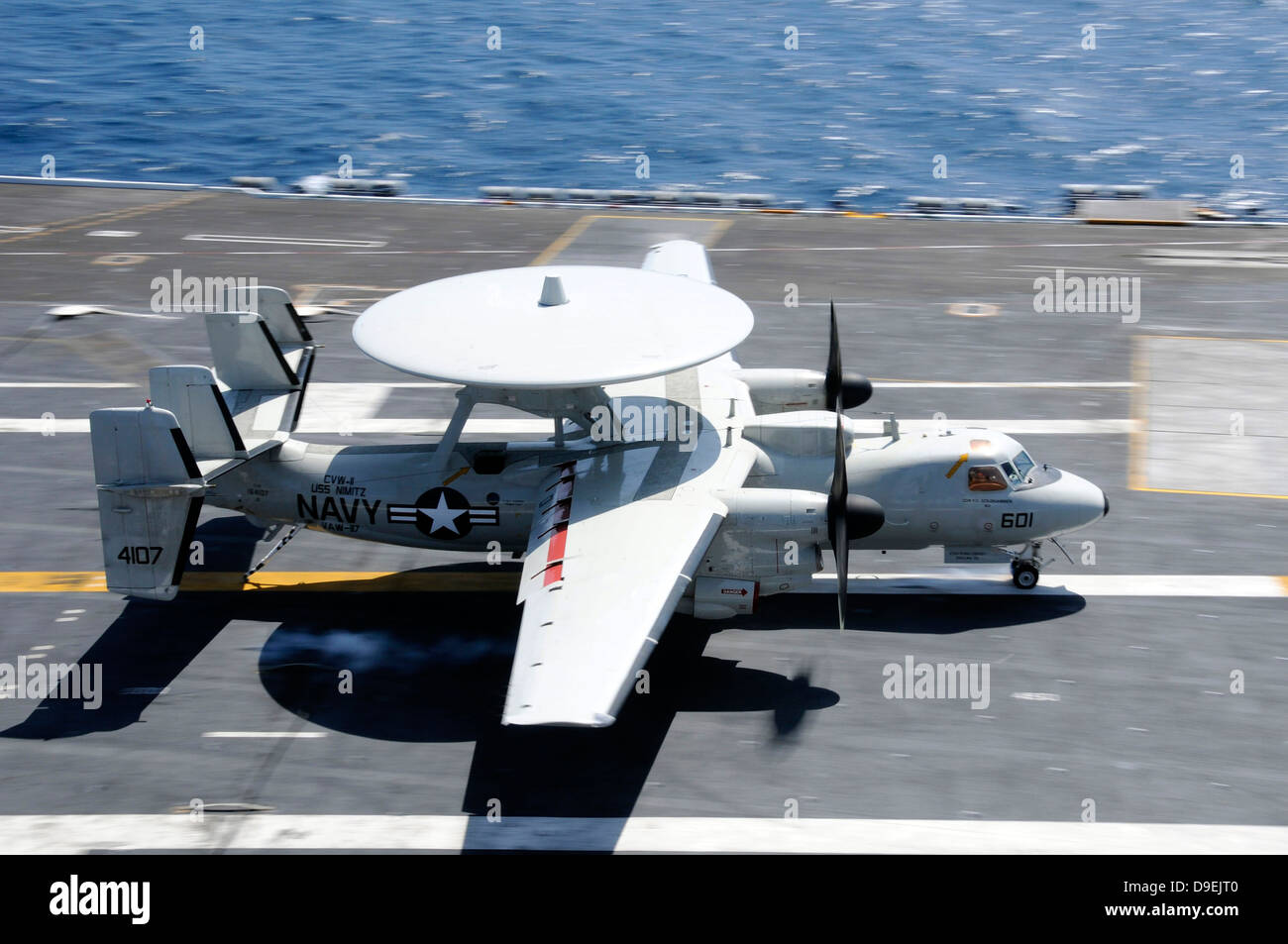 An E-2C Hawkeye lands aboard the aircraft carrier USS Nimitz. Stock Photo