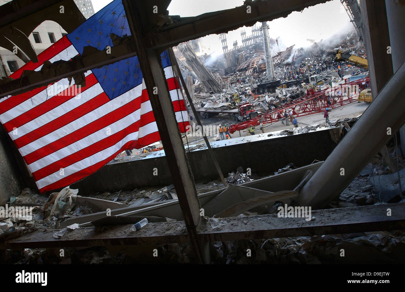 The American Flag is prominent amongst the rubble of what was once the World Trade Center. Stock Photo