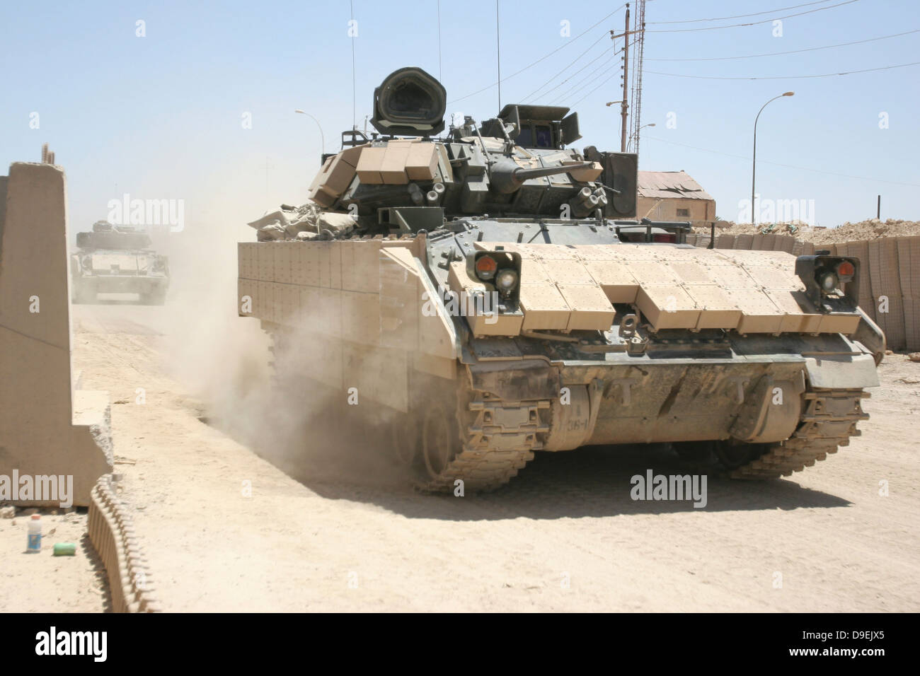 June 6, 2006 - U.S. Soldiers in an M2 Bradley Fighting Vehicle patrol past Command Post Hit, near Hit, Iraq. Stock Photo
