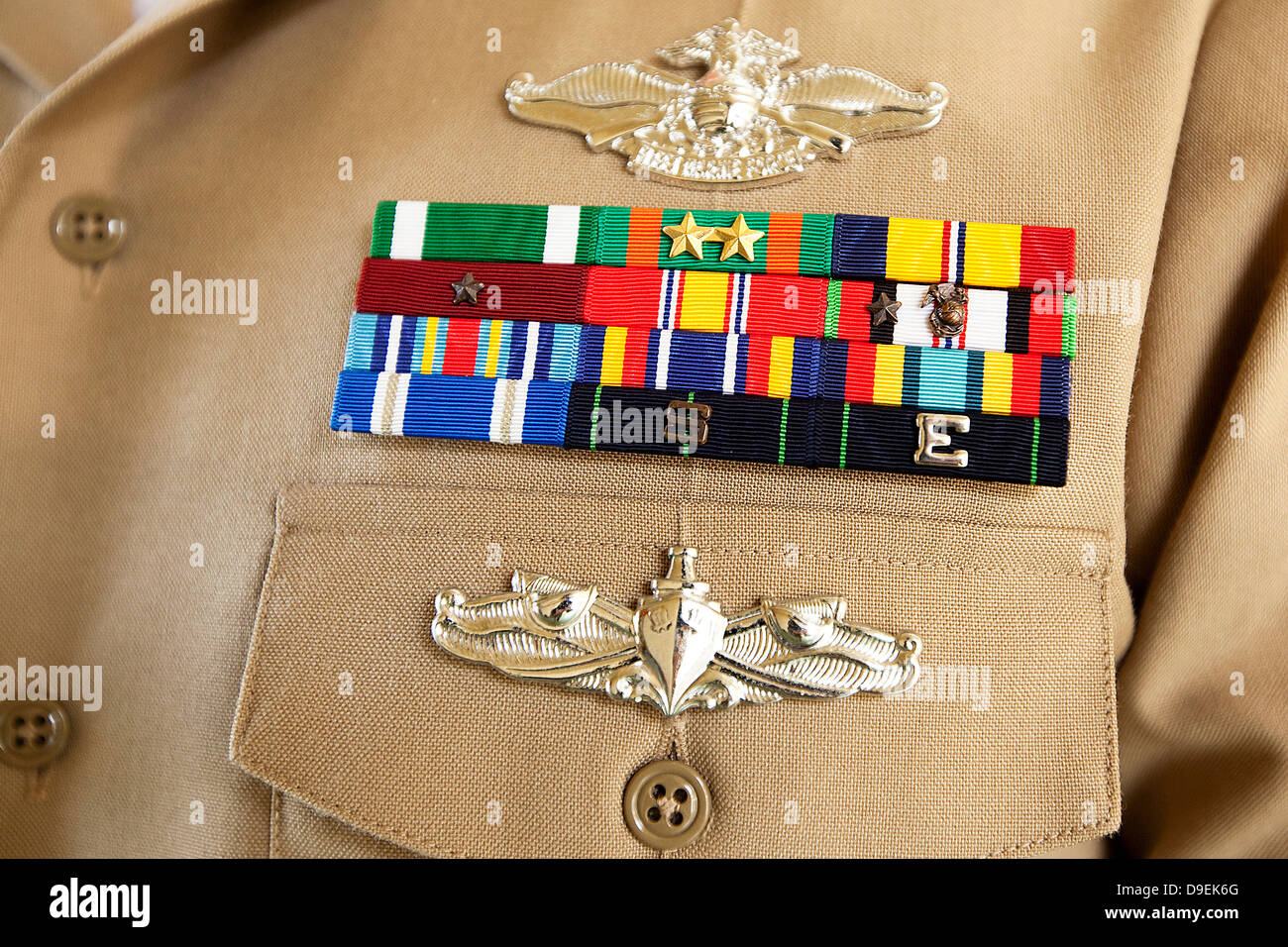 An eagle, globe and anchor device graces the Operation Enduring Freedom campaign ribbon on the uniform of a Petty Officer. Stock Photo