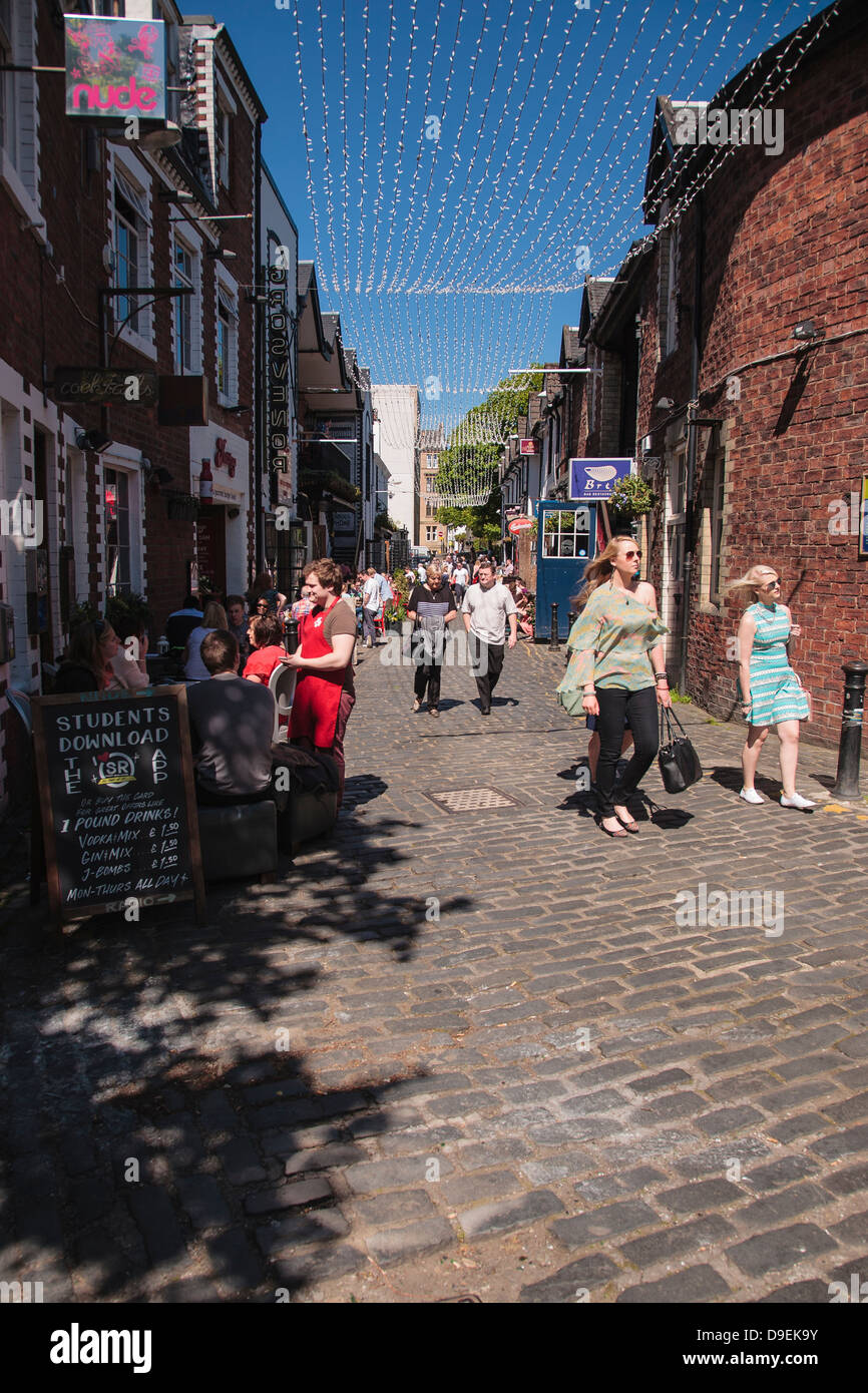 Some people enjoying the sunshine in Ashton Lane just off Byres Road in Glasgow. Stock Photo