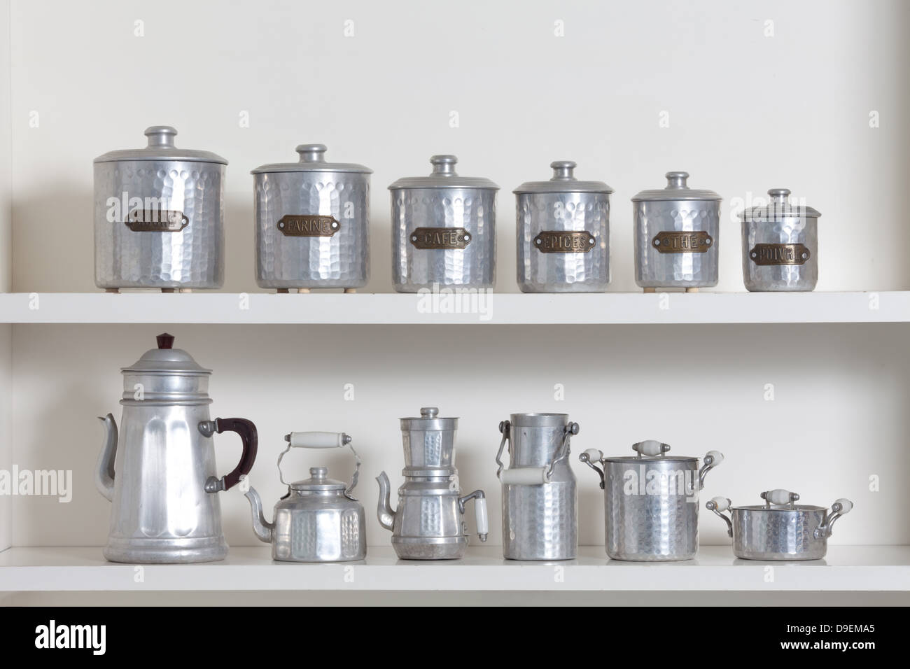 Kitchenware on white shelf Stock Photo