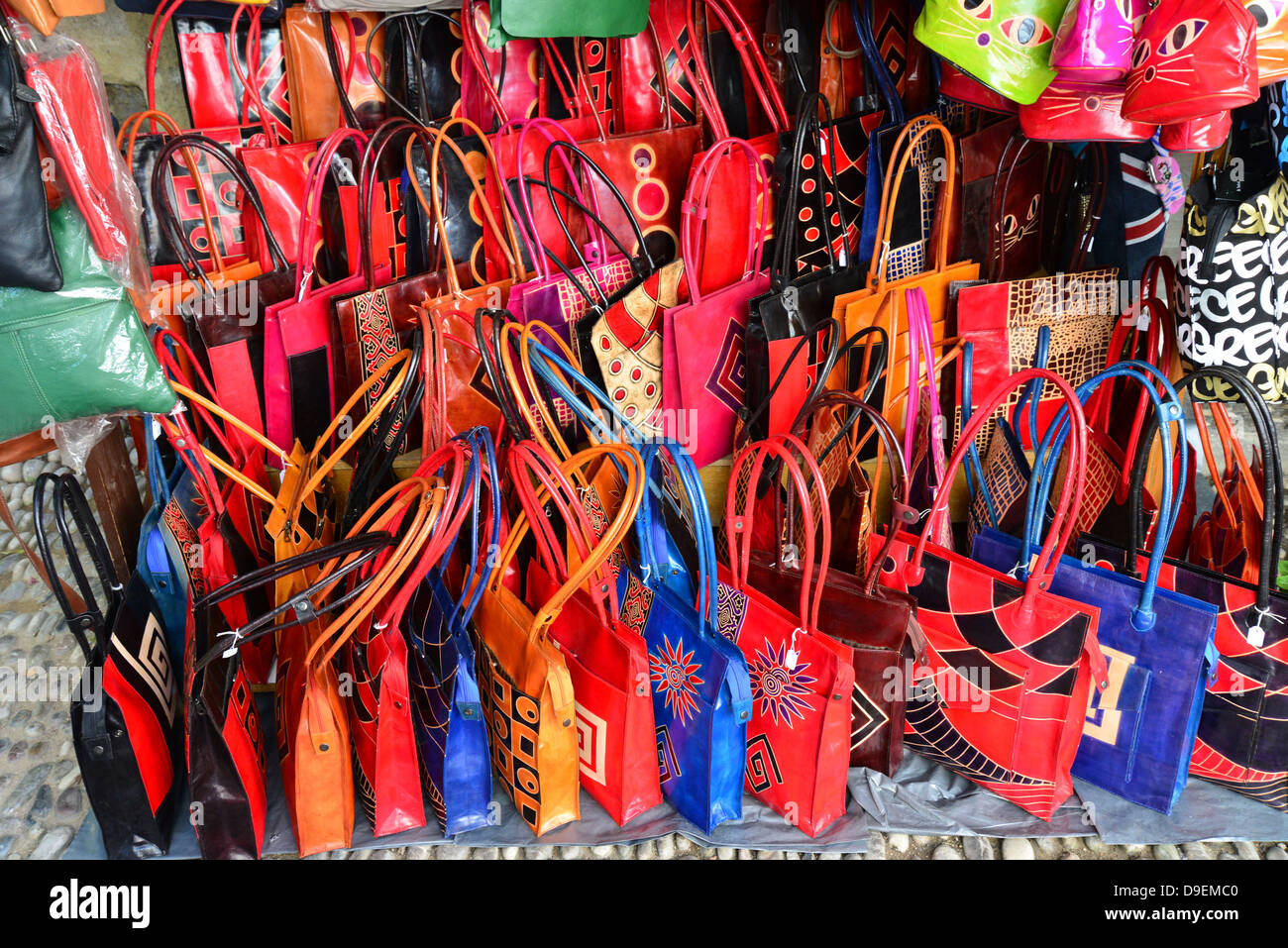 Leather handbags on display outside shop, Old Town, City of Rhodes, Rhodes (Rodos), The Dodecanese, South Aegean Region, Greece Stock Photo