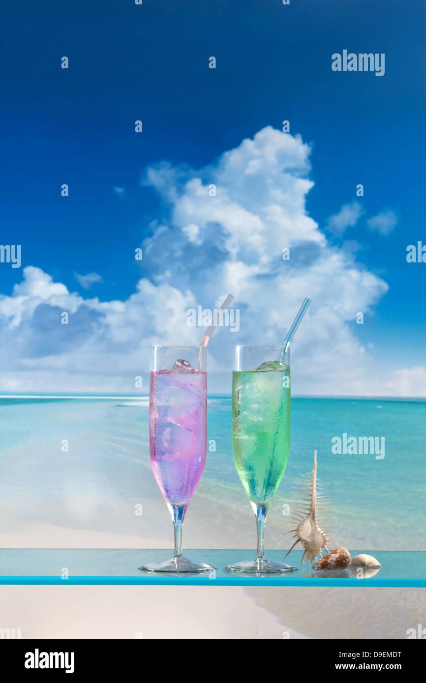 Cocktails and blue sky with clouds Stock Photo - Alamy