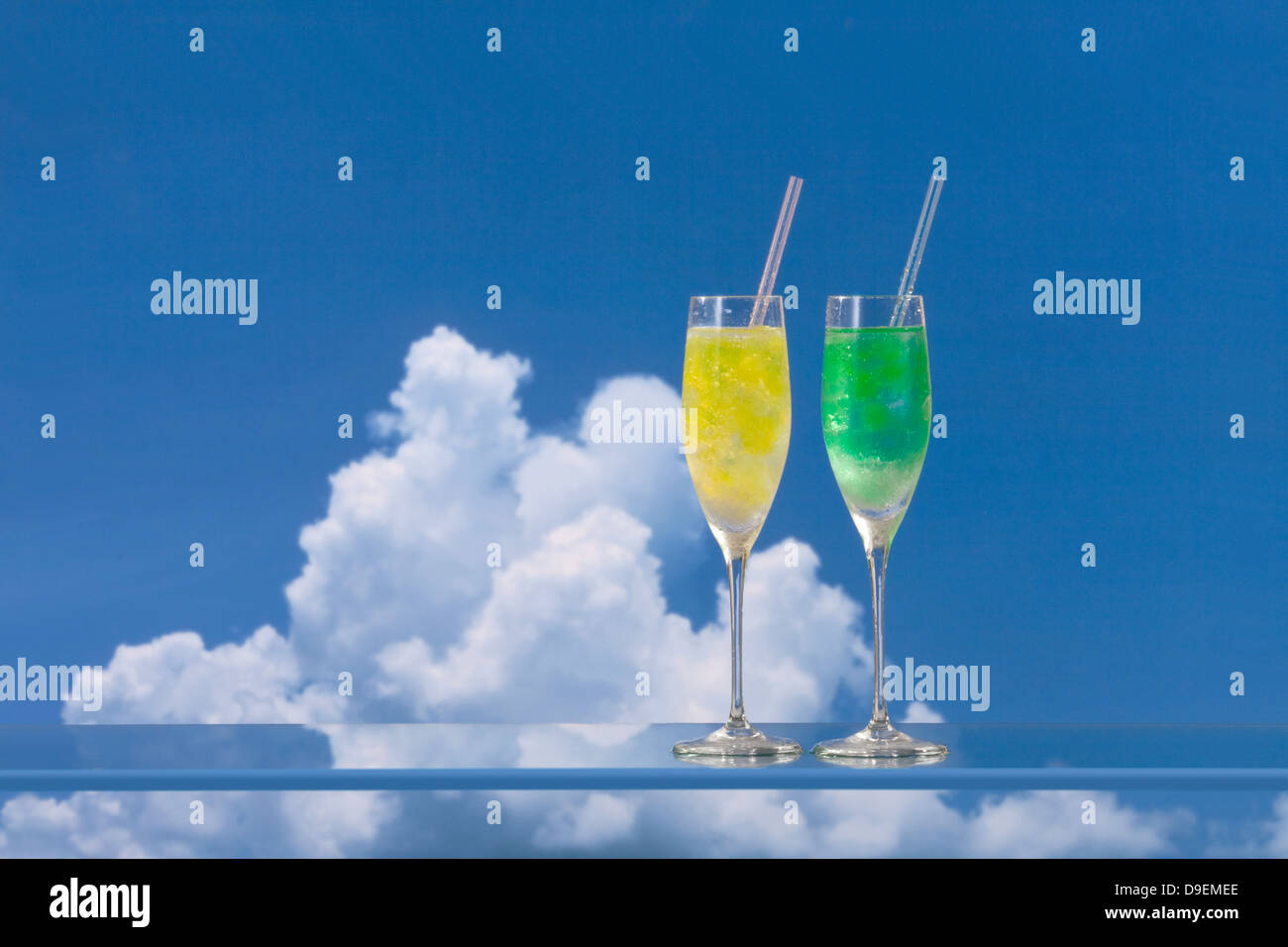 Cocktails and blue sky with clouds Stock Photo - Alamy