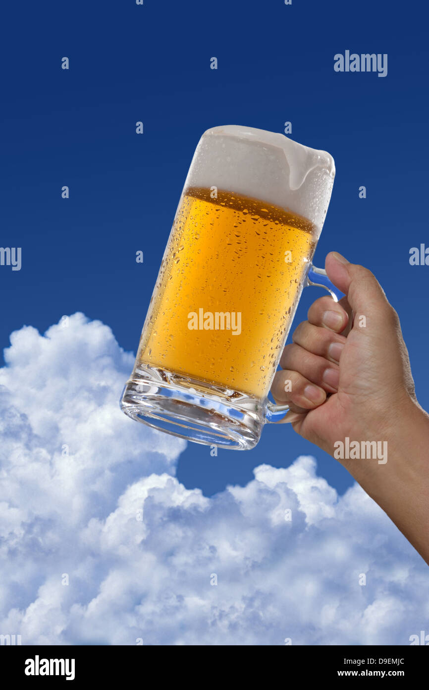 Beer and blue sky with clouds Stock Photo