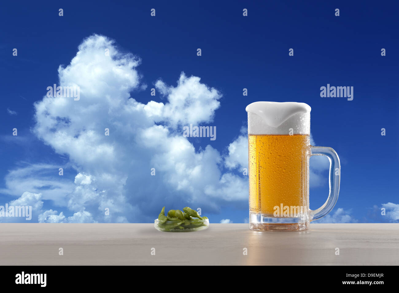 Beer, soybeans and blue sky with clouds Stock Photo